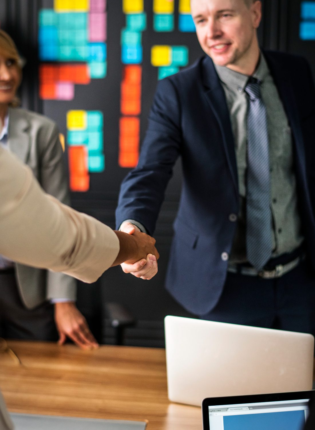 businessmen shaking hands in a meeting room