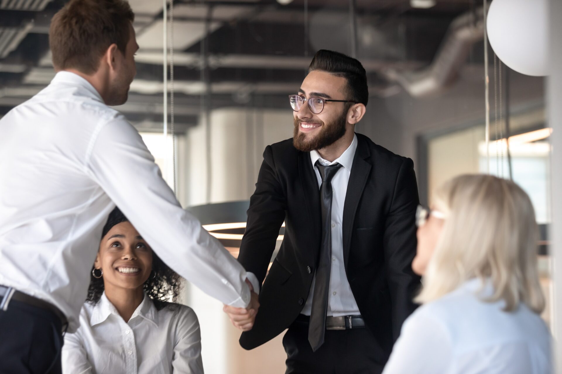 Businessmen shaking hands in meeting